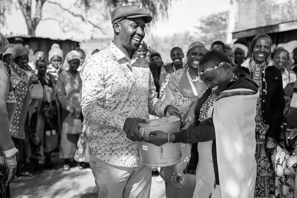 What are carbon credit funds_A DGB team member with the local community during the distribution of Energy efficient cookstoves_visual 6-Apr-07-2025-05-09-59-8426-PM 1